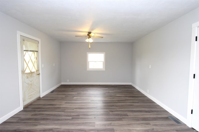 empty room with ceiling fan and wood-type flooring