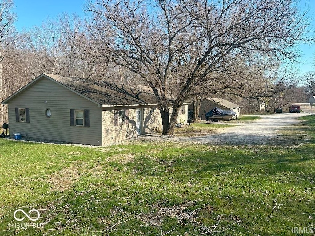 view of home's exterior featuring a lawn