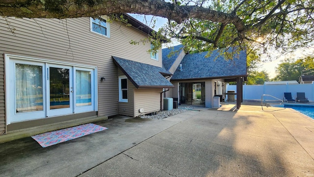 back of house featuring a patio area and a fenced in pool