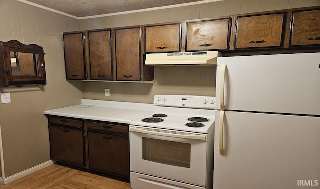 kitchen featuring light countertops, light wood-style flooring, dark brown cabinets, white appliances, and under cabinet range hood