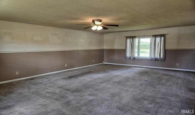 carpeted spare room featuring a ceiling fan, a textured ceiling, and baseboards