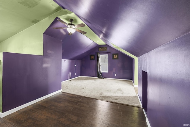 bonus room with wood-type flooring, vaulted ceiling, baseboards, and ceiling fan