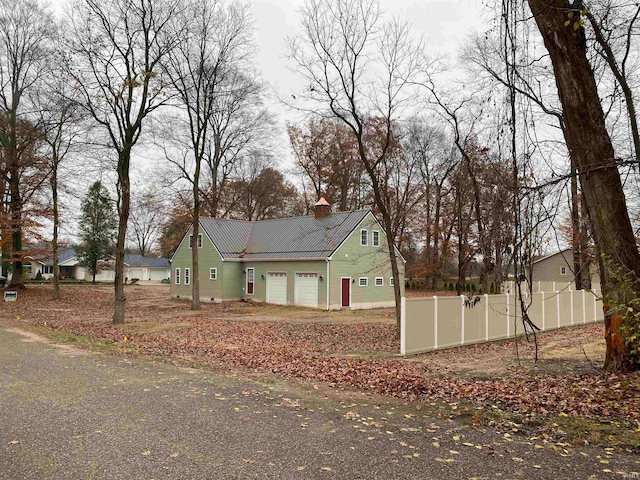 view of side of property with a garage