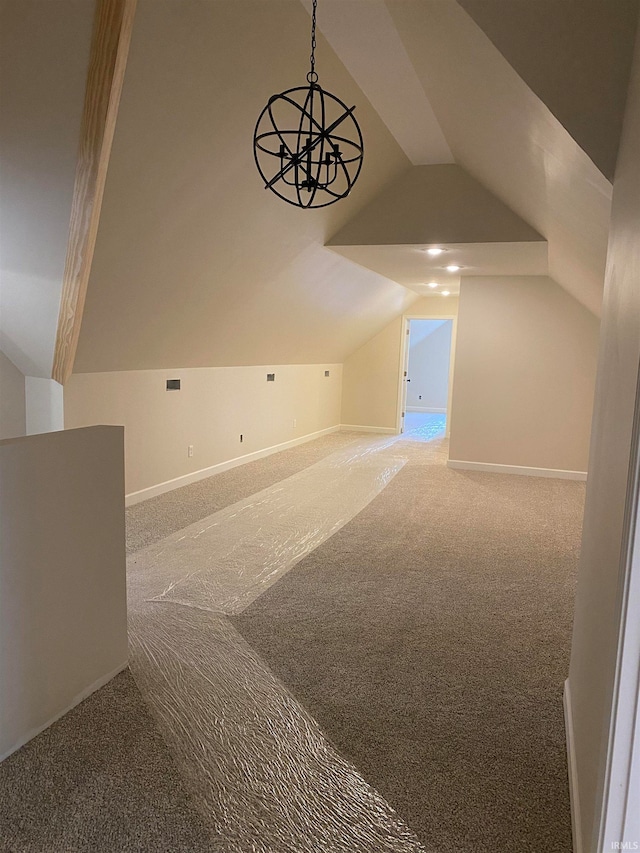 bonus room with carpet and lofted ceiling