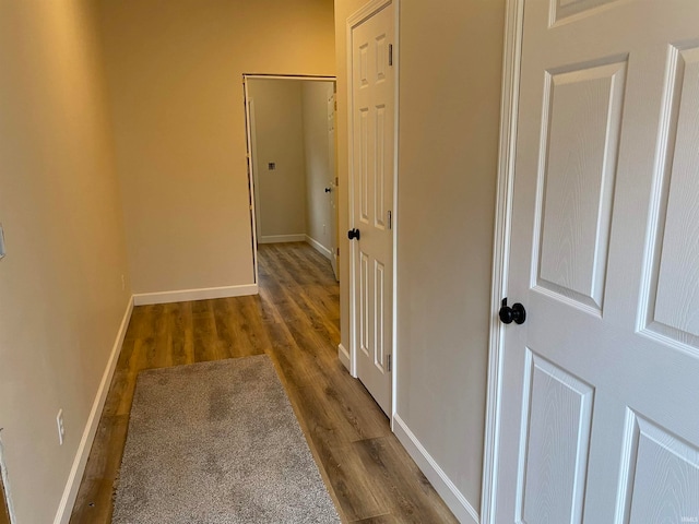 corridor with dark wood-type flooring