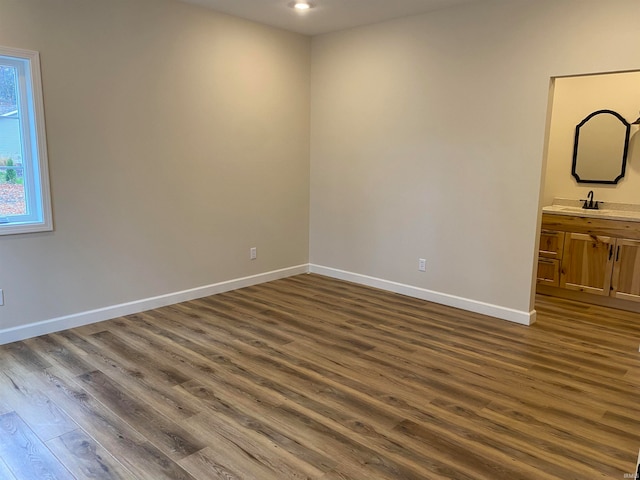 empty room with dark hardwood / wood-style floors