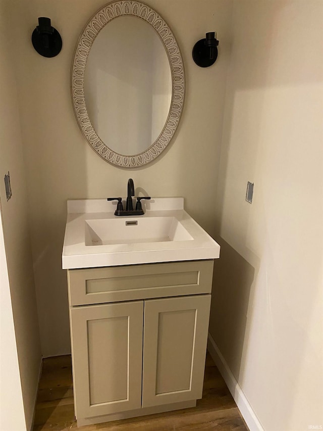 bathroom featuring hardwood / wood-style floors and vanity