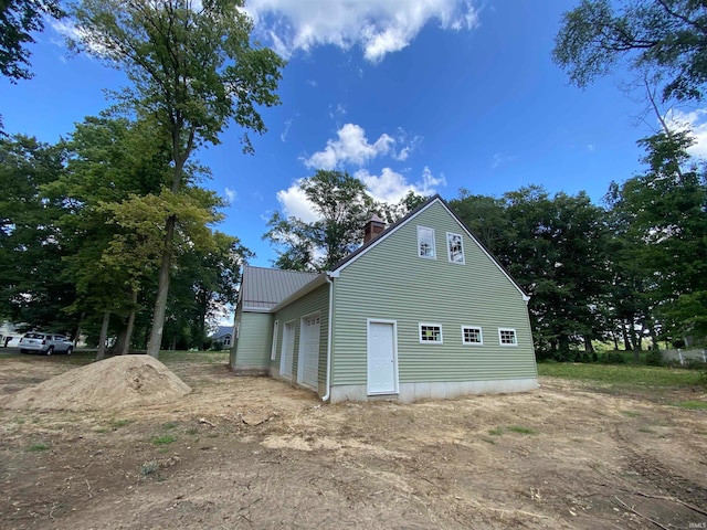 view of property exterior with a garage