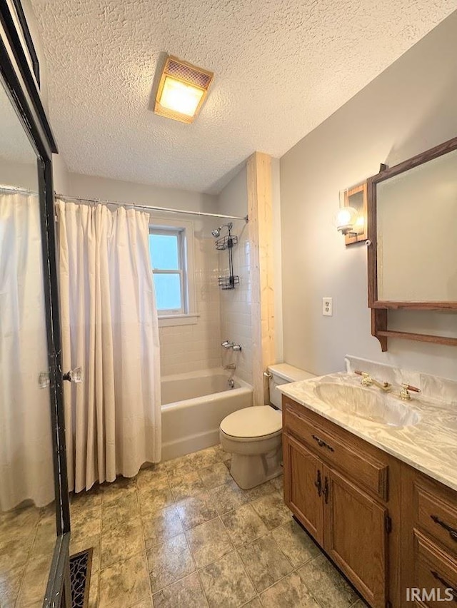 bathroom with visible vents, toilet, vanity, shower / tub combo, and a textured ceiling