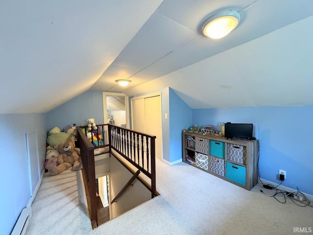 bonus room featuring a baseboard heating unit, vaulted ceiling, baseboards, and carpet floors