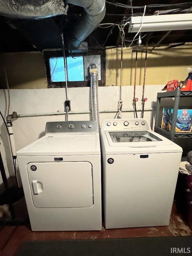 laundry room featuring washing machine and dryer and laundry area