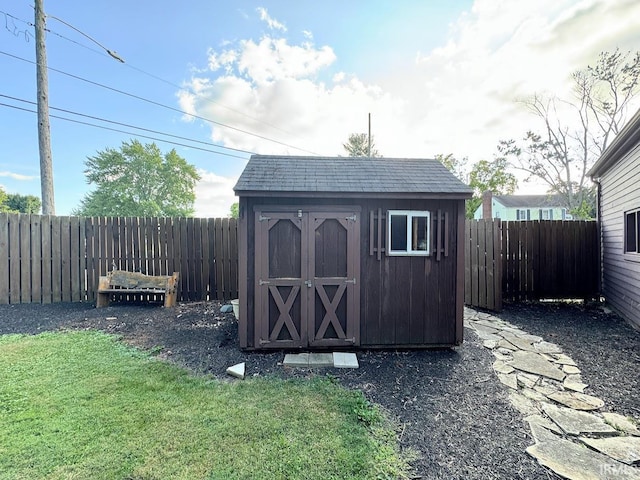 view of shed featuring a fenced backyard