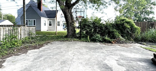 view of patio featuring fence