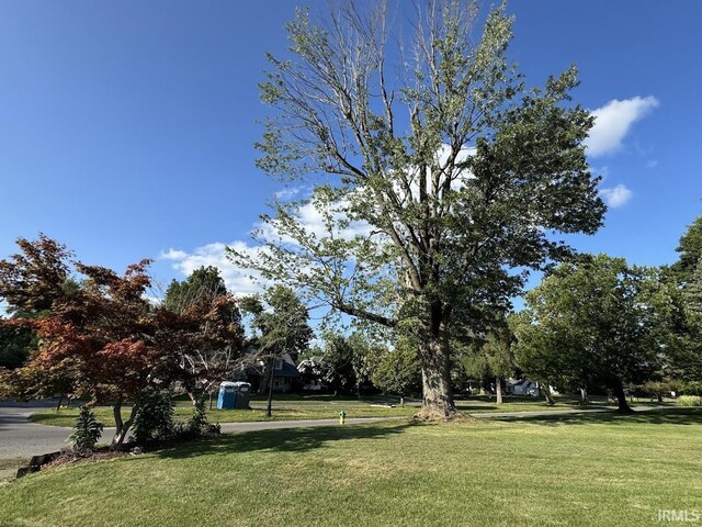 view of outdoor structure with a lawn