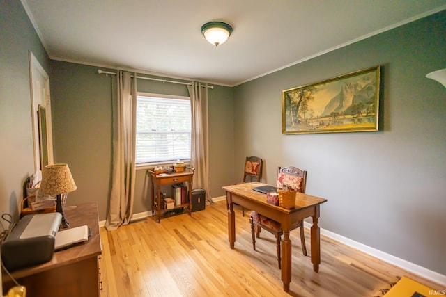 office featuring crown molding and light hardwood / wood-style flooring