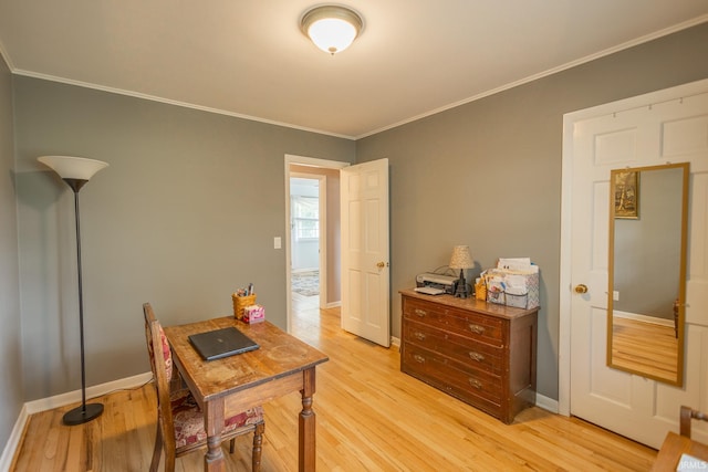 office featuring light hardwood / wood-style floors and crown molding