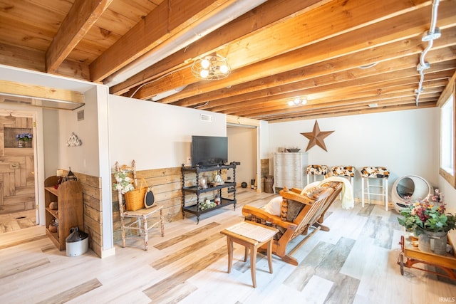 basement featuring light hardwood / wood-style flooring and wooden ceiling