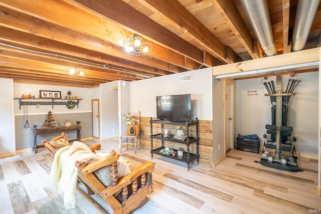 basement featuring light wood-type flooring and wooden ceiling