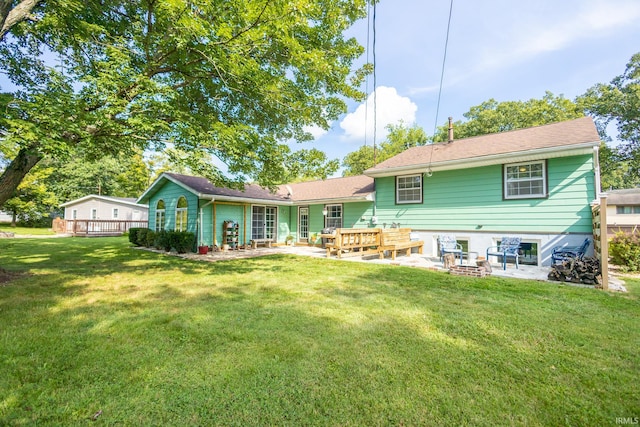 back of property featuring a patio, a deck, and a lawn