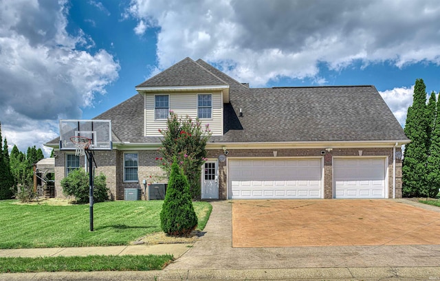 view of property featuring central AC, a front lawn, and a garage