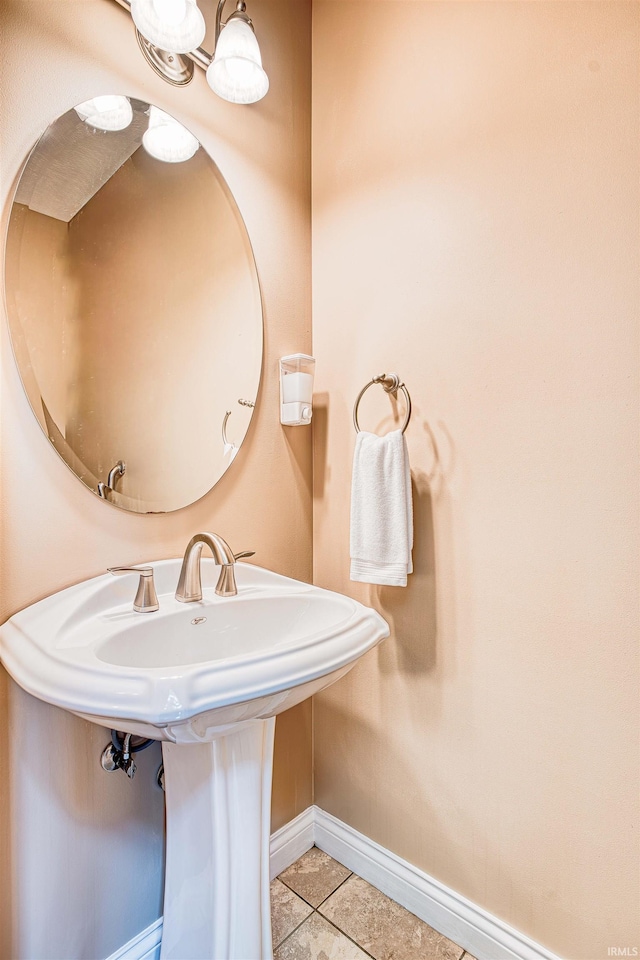 bathroom with tile patterned floors