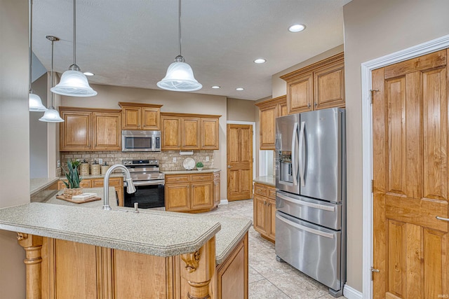 kitchen featuring light tile patterned flooring, backsplash, decorative light fixtures, stainless steel appliances, and kitchen peninsula