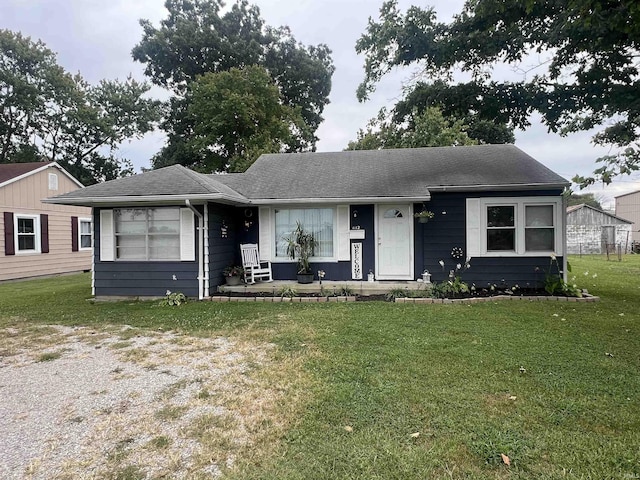 1112 E Fourth St, Mount Vernon, IN 47620 - ranch-style house with a shingled roof and a front yard