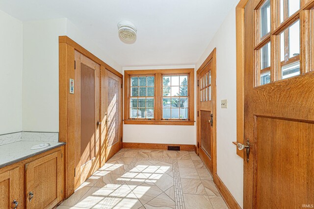 basement featuring wood walls and carpet floors