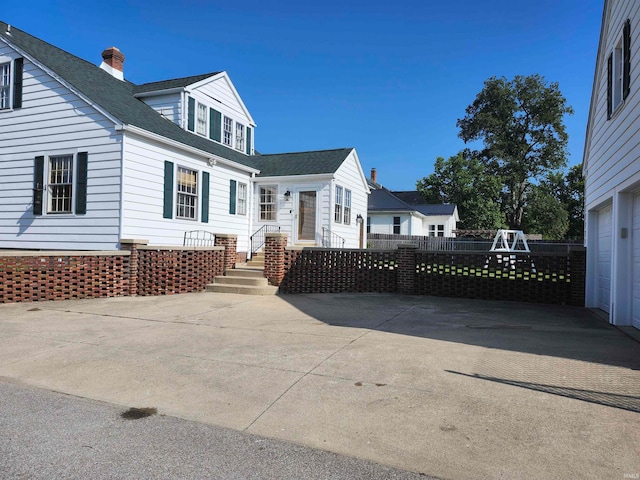 view of side of property featuring a garage