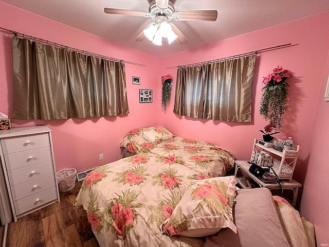 bedroom featuring ceiling fan and dark hardwood / wood-style floors