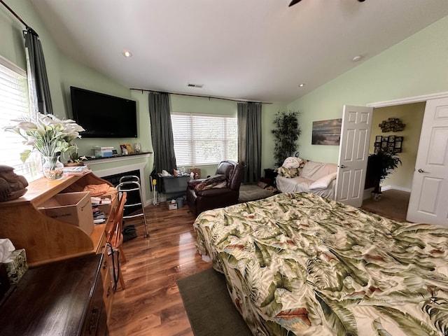 bedroom featuring visible vents, wood finished floors, lofted ceiling, and recessed lighting
