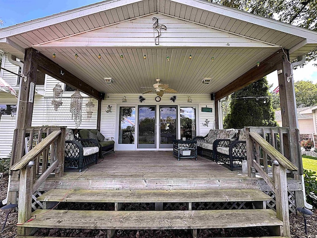 wooden terrace with ceiling fan, outdoor lounge area, and a gazebo