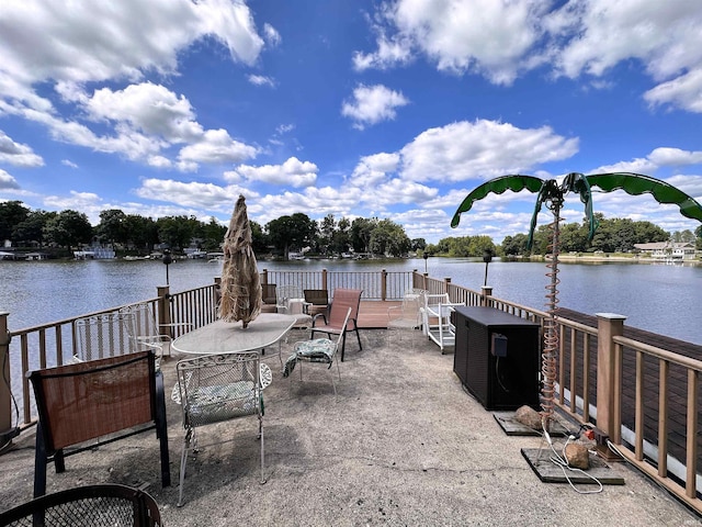 view of patio with a water view