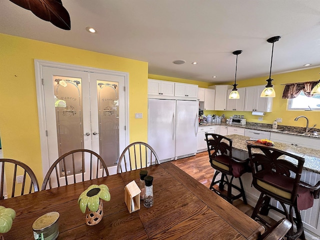 dining room featuring french doors, recessed lighting, and dark wood-style floors