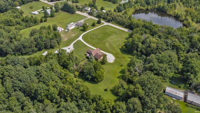 aerial view featuring a water view and a wooded view