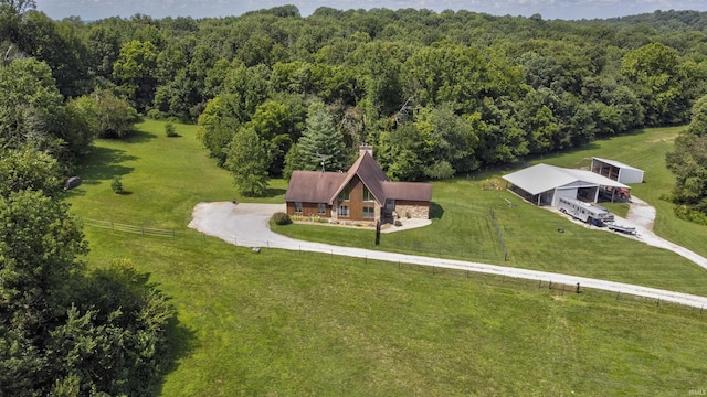 bird's eye view with a wooded view and a rural view