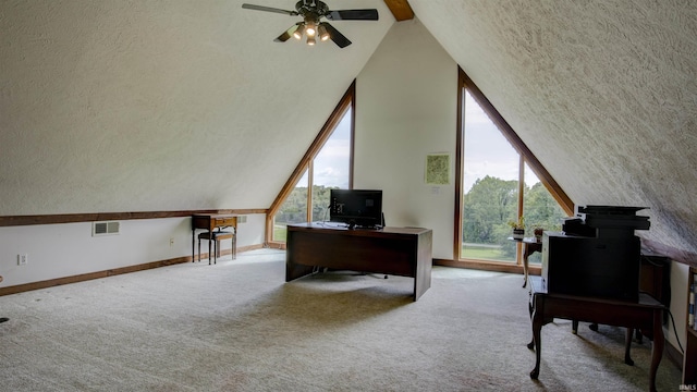 office with light carpet, baseboards, visible vents, lofted ceiling, and a textured ceiling