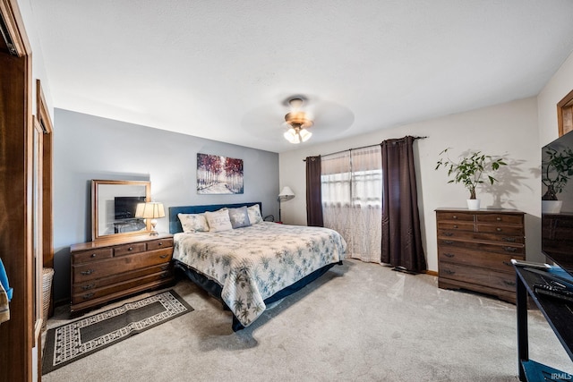 bedroom featuring ceiling fan and carpet flooring