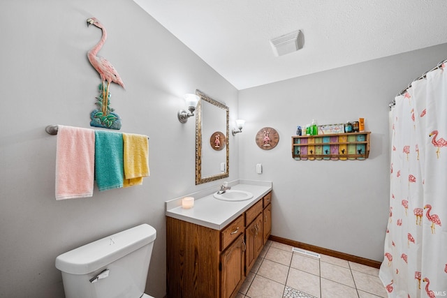 bathroom with a textured ceiling, tile patterned flooring, vanity, toilet, and a shower with curtain