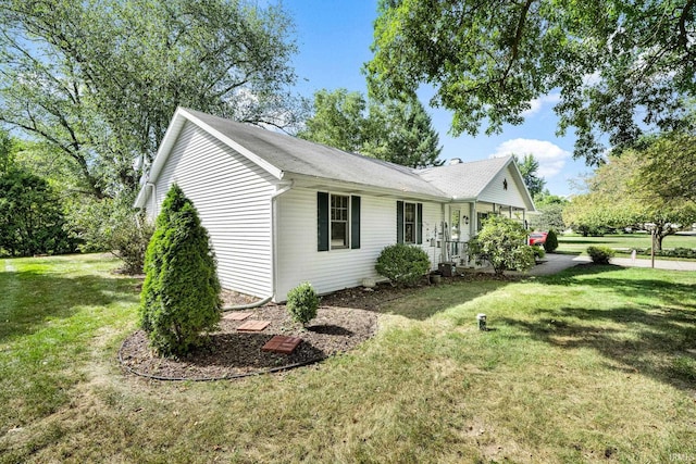 view of property exterior with a lawn