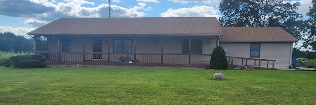 view of front facade featuring a front lawn and covered porch