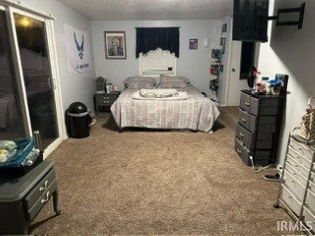 carpeted bedroom with a closet