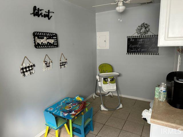 game room featuring tile patterned floors and ceiling fan