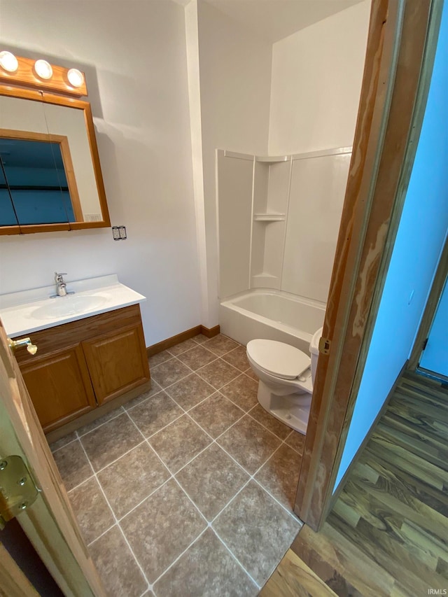 bathroom with wood-type flooring, toilet, and vanity