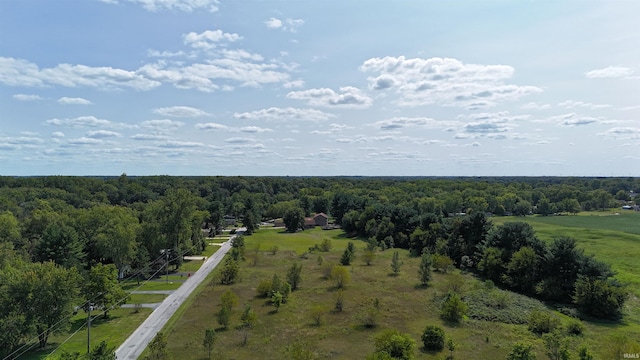 birds eye view of property with a rural view