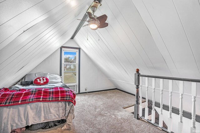 carpeted bedroom with ceiling fan and lofted ceiling