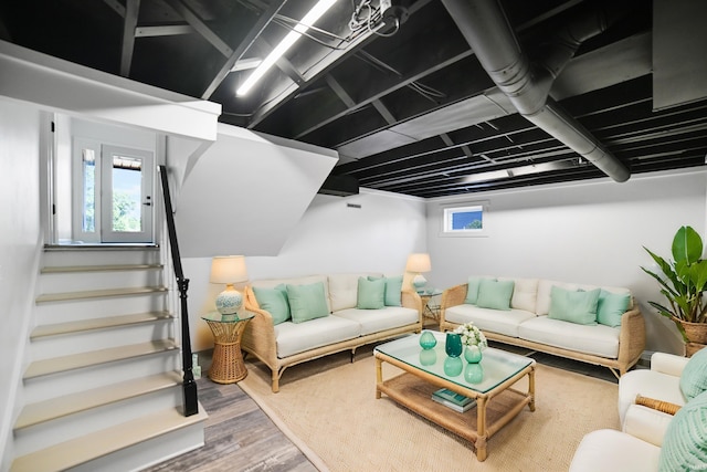 living room featuring a wealth of natural light and hardwood / wood-style floors