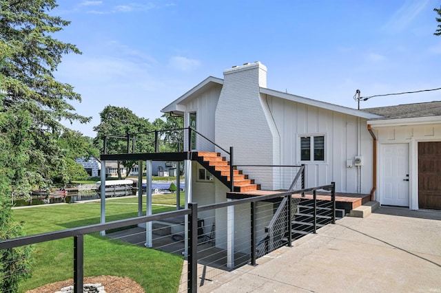 exterior space featuring a patio area and a lawn