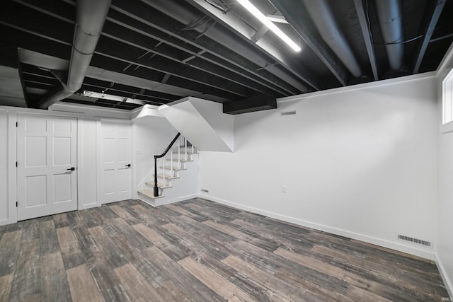 basement with hardwood / wood-style flooring