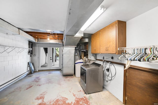 interior space with independent washer and dryer and cabinets